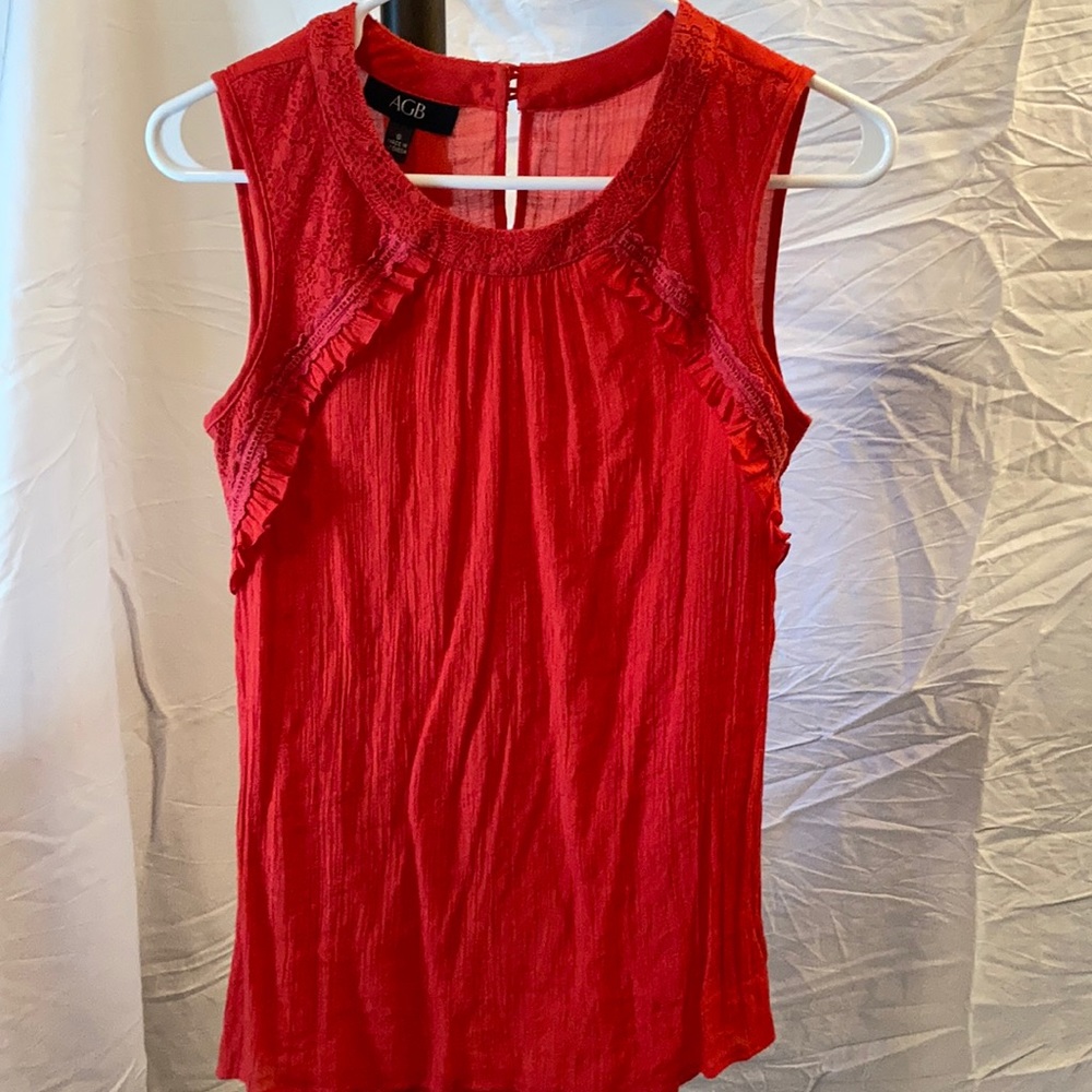 Great tank with a pop of color and neckline detail!